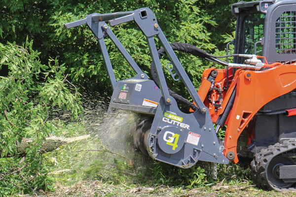 Forestry mulching head attachment grinding through brush and vegetation